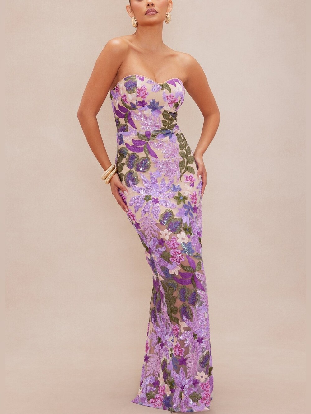 This strapless maxi evening dress with sequins and floral embroidery is designed